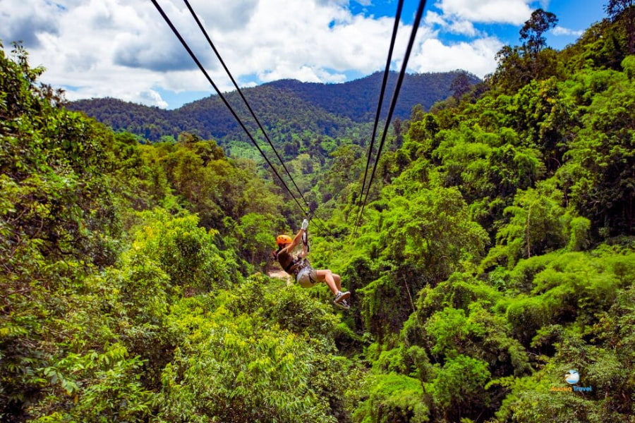 Traveler enjoying jungle zipline adventure in Thailand – Auasia Travel